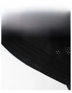 Macro detail of breathable mesh and sweat-absorbent band on the black sports cap