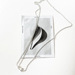 Elegant 925 sterling silver U-shaped pendant necklace with a minimalist chain on card