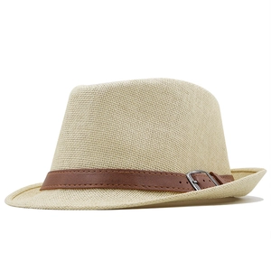 Classic straw fedora hat with a deep brown leather band and silver buckle on white background