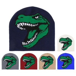 Detail showing various colors of knitted beanies with green cartoon dinosaur patterns