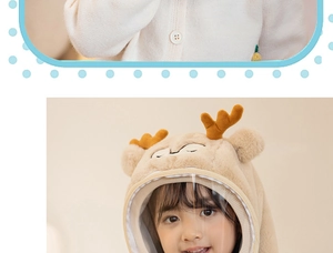 Detail of plush beige toddler hat with cute antlers and clear protective face shield