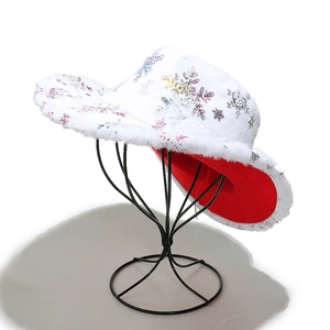 Detail of plush Christmas cowboy hat with colorful snowflake patterns and red lining
