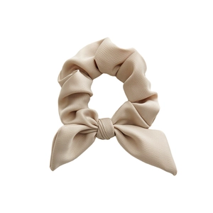 Elegant beige bow scrunchie with pleated chiffon texture for women's hair styling