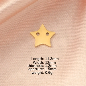 Macro shot of 12mm gold-plated stainless steel star charm with dual holes on silk