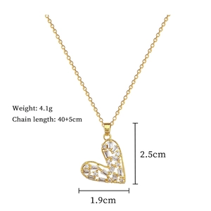 Detail view of gold heart necklace with zircon inlay and product size specifications