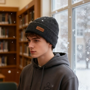 Deep grey winter knit beanie for men and women featuring a stylish leather logo patch