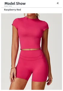 Detailed view of the raspberry red two-piece sports set with cropped top and cycling shorts