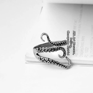 Macro detail of vintage silver octopus ring showing intricate tentacle sucker textures