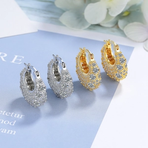 Sparkling pavé-set zircon hoop earrings in gold and silver finishes for a glam look