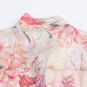 Elegant pink floral chiffon maxi dress with belt showing neckline detail and soft texture