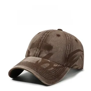 Detailed view of LA&DH 3D embroidery and flame patterns on washed brown baseball cap