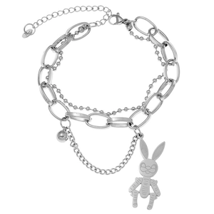 Detailed view of triple-layer silver chain bracelet with punk mechanical bunny pendant