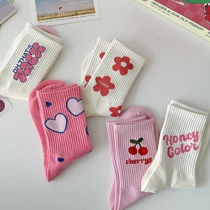 Five pack of pink and white cotton crew socks with cute heart and flower patterns