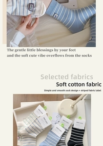 Detail of cotton striped socks featuring unique struggle cloth patch and soft texture