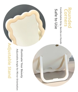 Detail showing rounded wave edges and adjustable U-shaped stand of cream makeup mirror