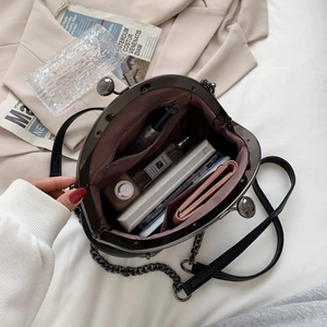 Fashionable black shell chain bag with spacious interior for phone and daily accessories
