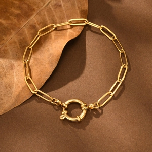 Macro view of gold plated stainless steel rectangle link chain with round spring clasp
