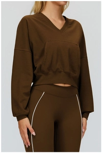 Detail view of coffee brown hooded sweatshirt featuring a V-neck and ribbed cuffs design