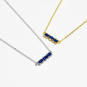 925 silver necklace with rectangular blue gemstones and white diamond accents on white background