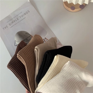 Vertical ribbed cotton socks in six neutral colors including beige, brown and black