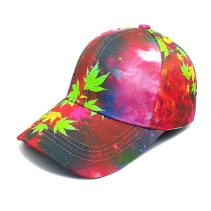 Detail of creative baseball cap featuring galaxy nebula print and colorful maple leaves