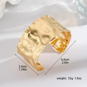 Detailed size specifications of the wide gold ginkgo leaf cuff bracelet with hammered texture
