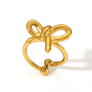 Detailed view of an adjustable golden butterfly ring with a polished metallic finish