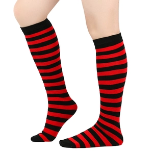 Detail of red and black striped knee-high socks showing the elastic knit fabric and texture