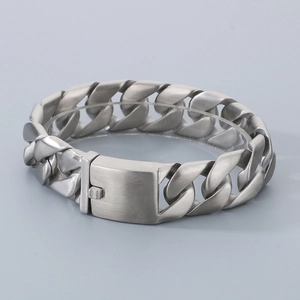 Detailed close-up of matte silver Cuban link bracelet featuring a secure box clasp closure