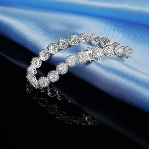 5mm silver tennis bracelet with round cubic zirconia on navy silk background