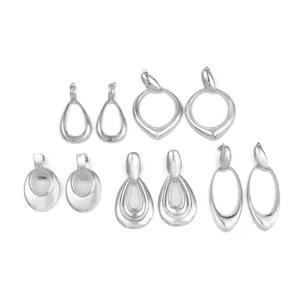 Five pairs of irregular silver geometric earrings set with a high-polished finish