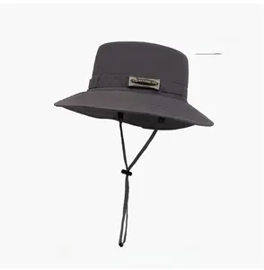 Close-up of quick-dry gray sun hat with adjustable drawstring and embroidered patch