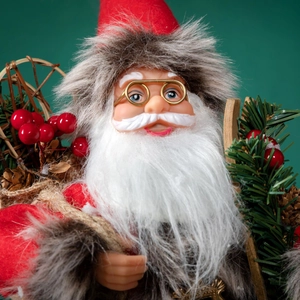 Classic Santa Claus figurine with red suit, golden glasses, and green pine needle accents