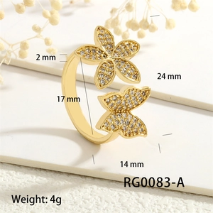 Detail view of gold butterfly and flower ring with zircon inlays and measurements