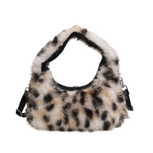 Detail view of the soft plush leopard print crescent bag texture and ring buckle