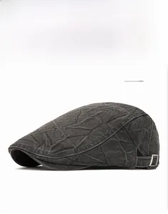 Detail view of washed gray cotton beret cap with adjustable side metal buckle