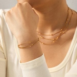 Elegant gold-plated triple-layered titanium steel necklace and bead chain bracelet set