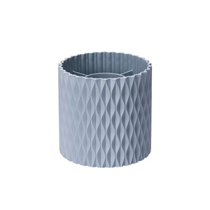 Rotating makeup brush organizer in blue-grey with a wavy textured surface and dividers