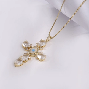 Golden cross necklace with evil eye pendant and micro-set cubic zirconia stones