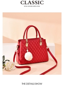 Red quilted handbag with gold hardware, white pompom charm, and rose detail