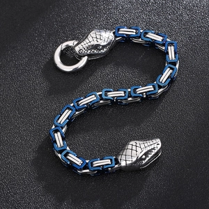 Detail of silver and blue snake head clasp with Byzantine chain stainless steel bracelet