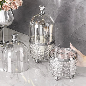 Rotating makeup brush holder with dustproof lid and silver bear topper detail
