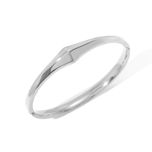 Detailed macro view of silver minimalist geometric bangle with polished mirror finish