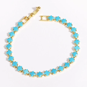 Detail of 18k gold plated square zircon spacer bead with sky blue gemstone inlay