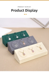 Macro detail of microfiber jewelry display stands with assorted crystal pendant necklaces
