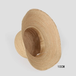 Detailed view of handmade raffia sun hat with 10cm brim and internal sweatband