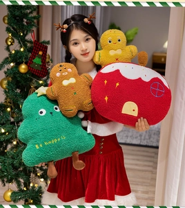 Christmas plush pillow set featuring a gingerbread man and tree with Be Happy embroidery