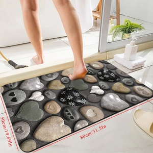 Detail showing the 80x50cm pebble pattern diatomite bath mat with non-slip texture