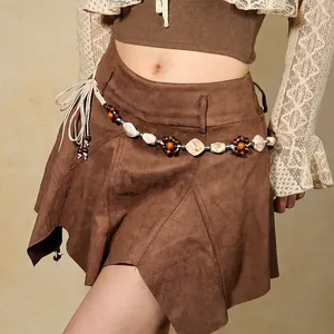 Bohemian suede mini skirt featuring ethnic woven belt with wooden beads and shells