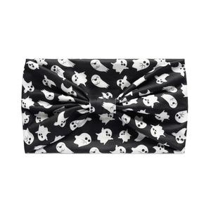 Close-up of elastic black headband featuring cute white ghost patterns for Halloween